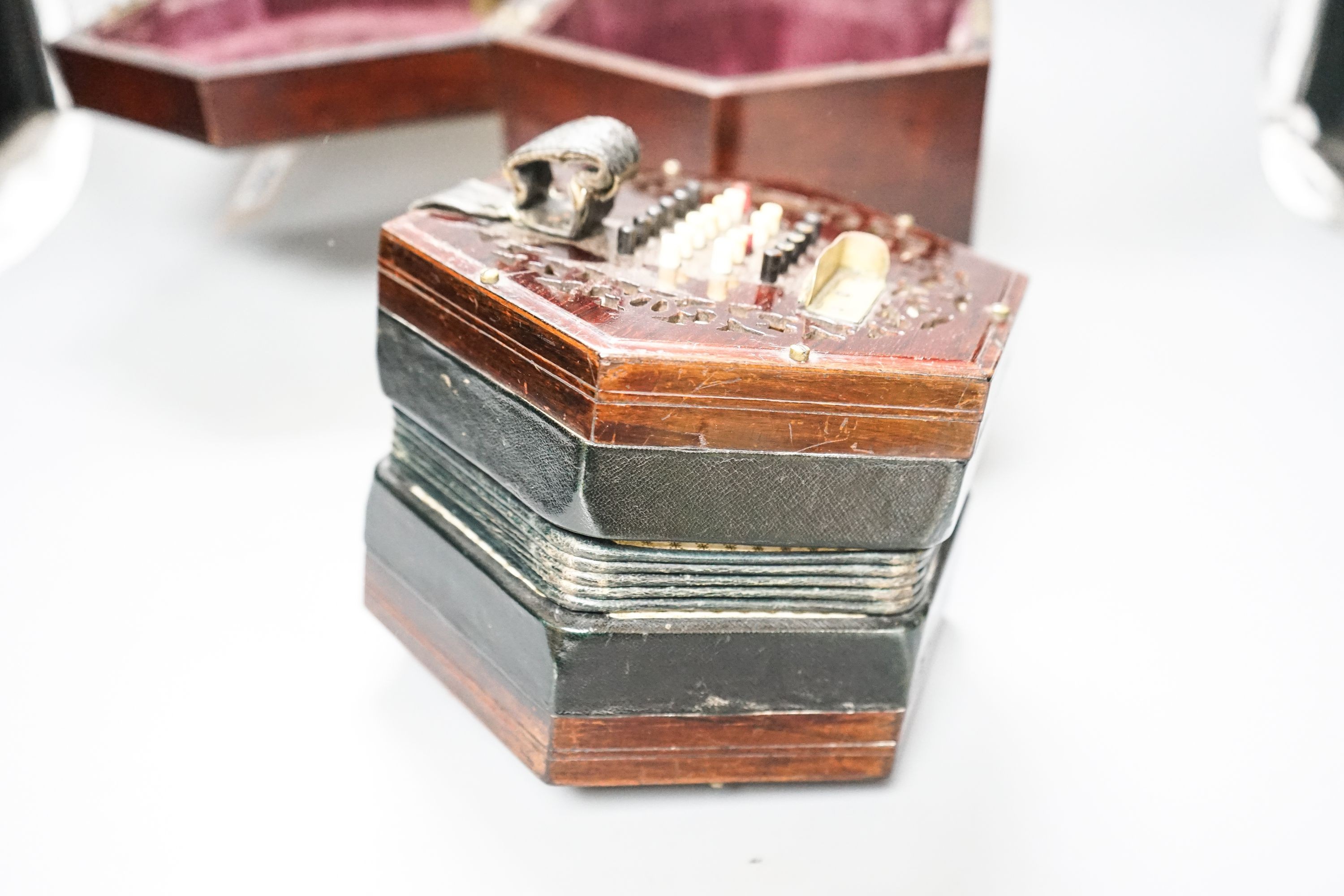 A Victorian Lachenal concertina with 48 buttons in rosewood case
